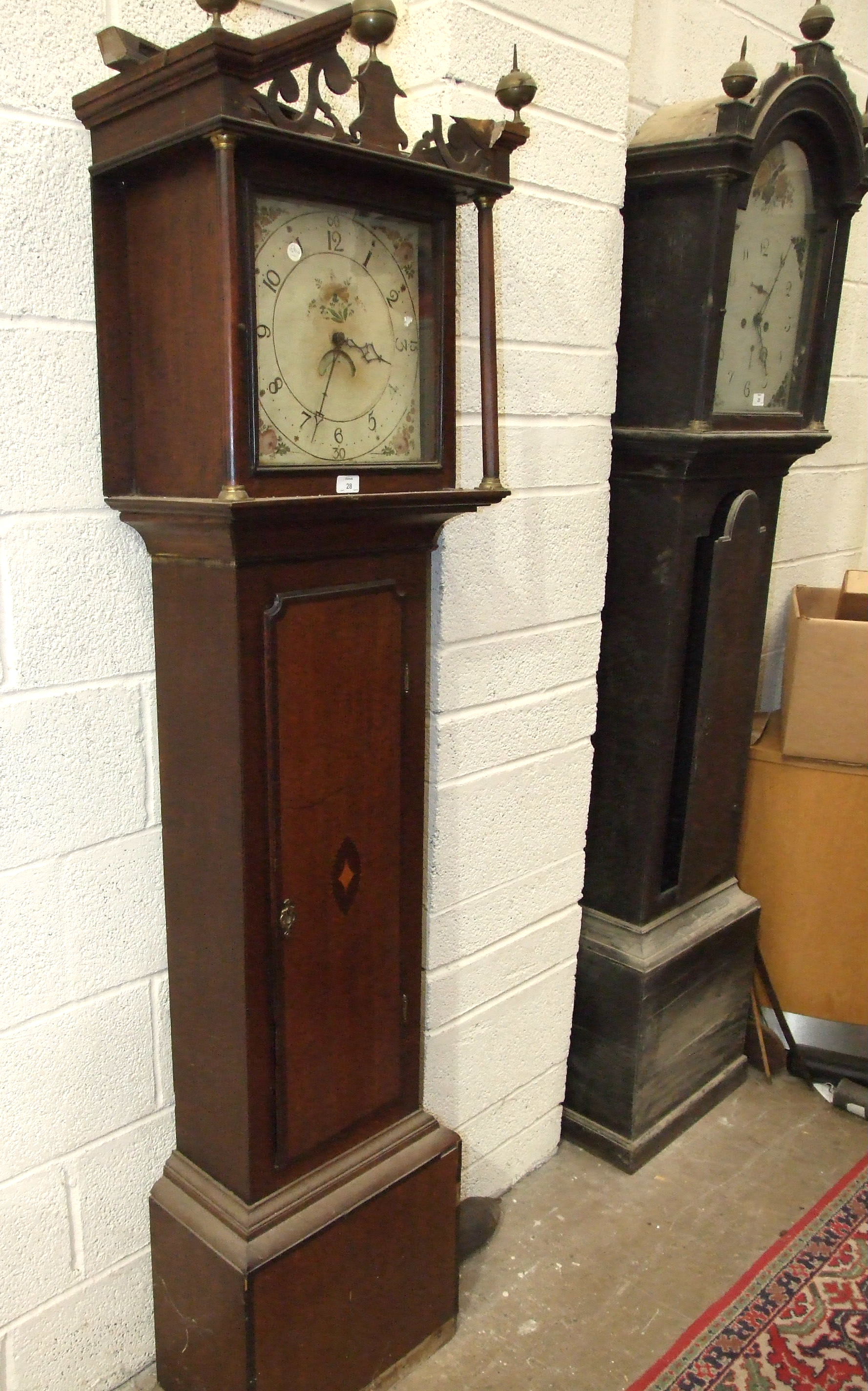 A 19th century mahogany long case clock with painted arched dial and bell-striking twin-train