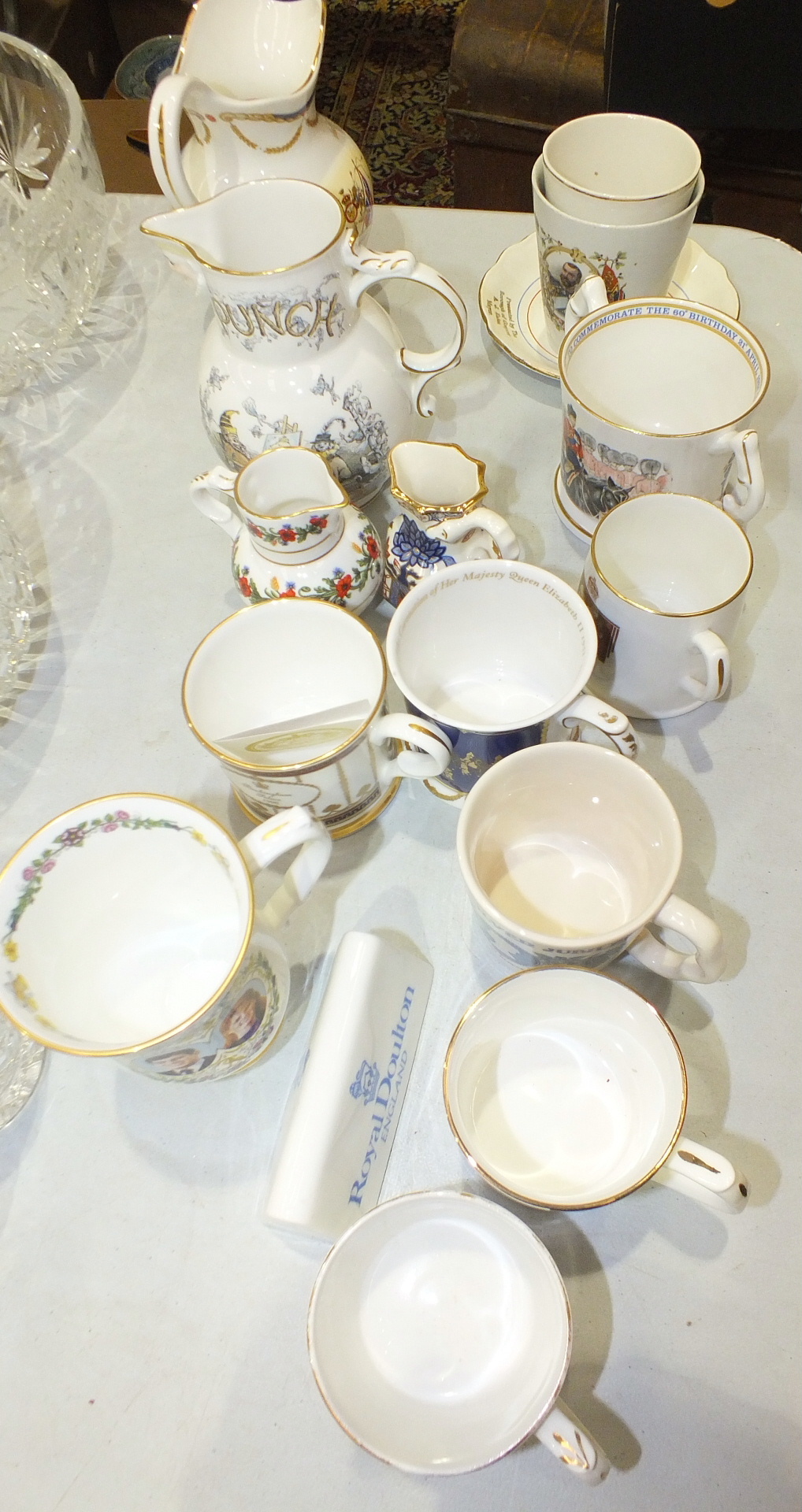 A collection of ceramic commemorative ware, including a Royal Doulton King George V & Queen Mary