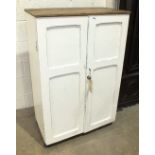 A painted wood filing cupboard, the pair of painted panelled doors enclosing the interior fitted