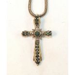 A 9ct gold cross pendant set emeralds and diamond points, on 9ct gold snake-link chain, 7g.