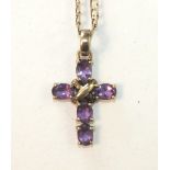 A cross pendant set amethysts, on 9ct gold curb-link chain, 7.9g.