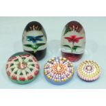 Two Perthshire millefiore glass paperweights and three Strathearn glass paperweights, (5).