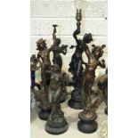 A collection of four spelter figures and a bronzed metal table lamp, (5).