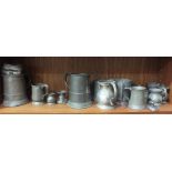 A collection of mainly-19th century pewter tankards and dishes, some with touch marks, approximately