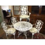 A modern white-painted aluminium garden table and four chairs, table 102cm diameter.