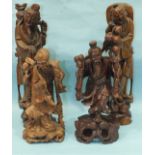 A carved wood figure of a Chinese deity, 32cm high and three others, (4).