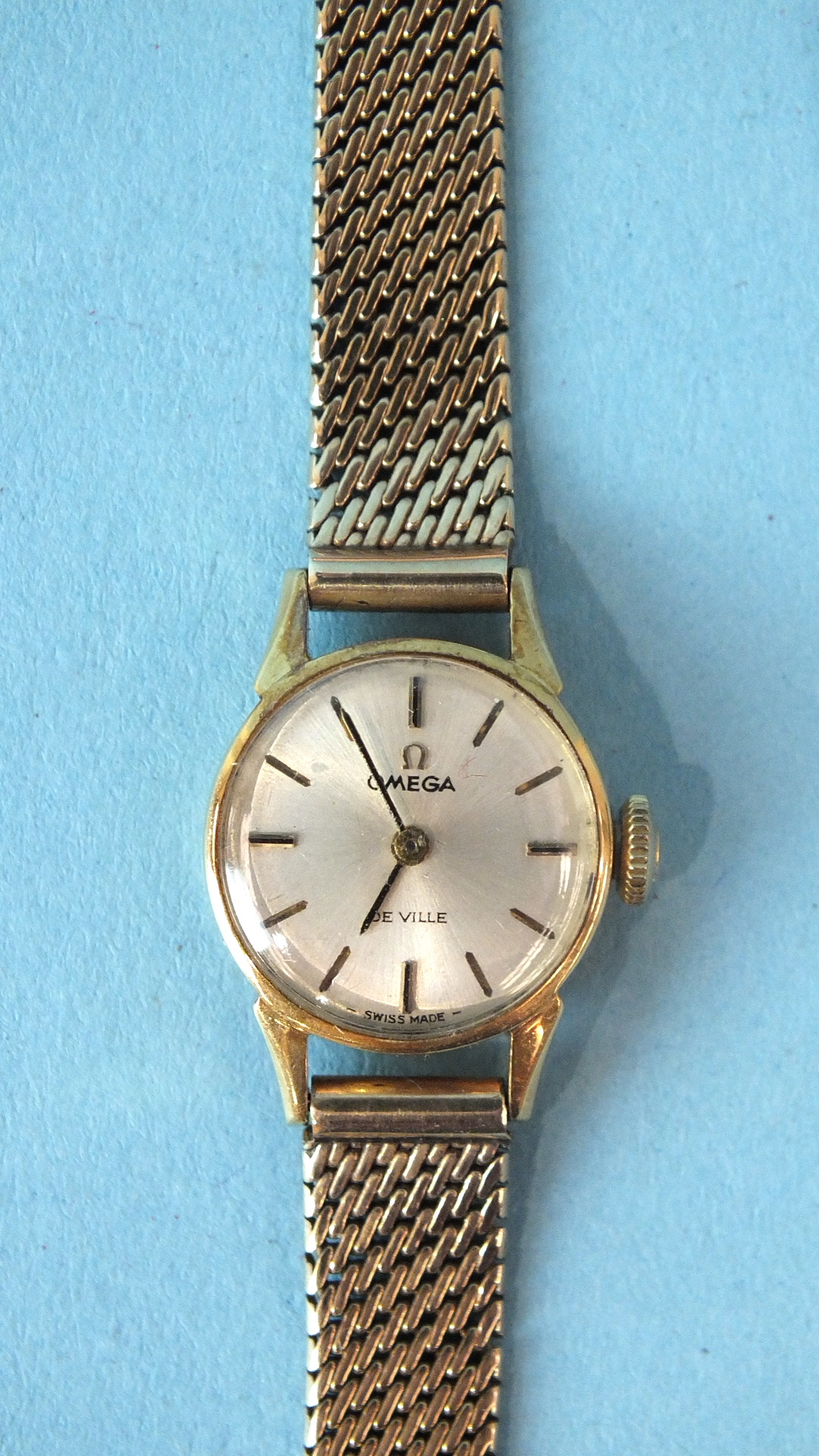 Omega, a lady's Omega De Ville mechanical wrist watch, the 15mm circular face with baton numerals,