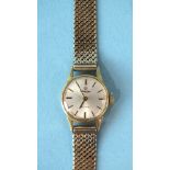 Omega, a lady's Omega De Ville mechanical wrist watch, the 15mm circular face with baton numerals,