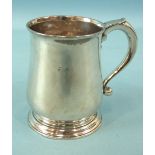 A George II small baluster tankard with lapette-capped handle, 10cm high, maker EV, London 1734,