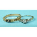 A solitaire diamond ring in 18ct gold mount, (a/f), 1.4g and a 14ct gold ring set two sapphires,