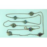 An Art Nouveau silver chain interspersed with seven various blue and green enamel plaques, each