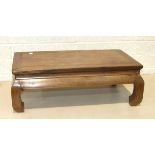 A late-19th/early-20th century Chinese hardwood low table on short shaped legs, 71 x 40cm,