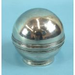 A white metal circular box and cover, or pill roller, on collar stand, 7cm diameter.