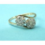 A diamond cross-over ring set two clusters of 8/8-cut diamonds, in 18ct yellow gold mount, size O,