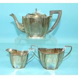 A three-piece bachelor's tea service of shaped oval form, comprising: teapot, cream jug and sugar