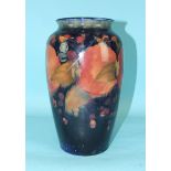 Moorcroft, a large vase of baluster form decorated in the Pomegranate pattern on a dark blue ground,