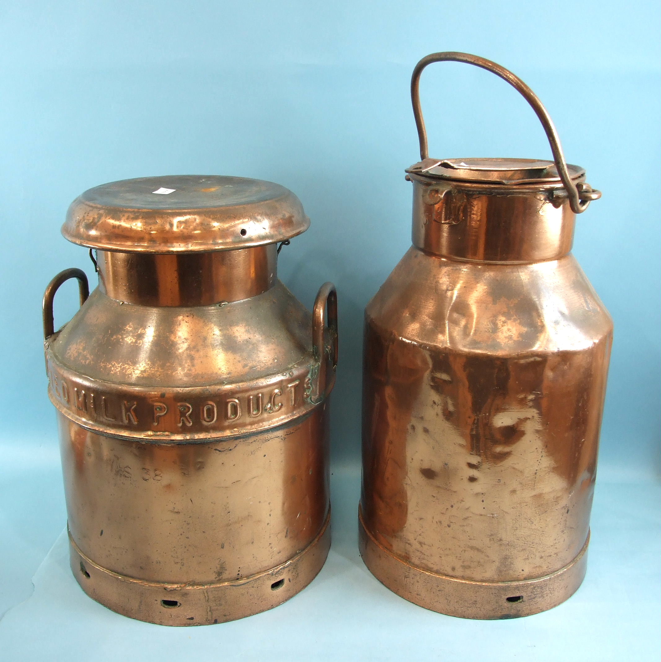 A coppered milk churn marked 'Dry Milk Product', 48cm high and another marked 'M & P Dairies',