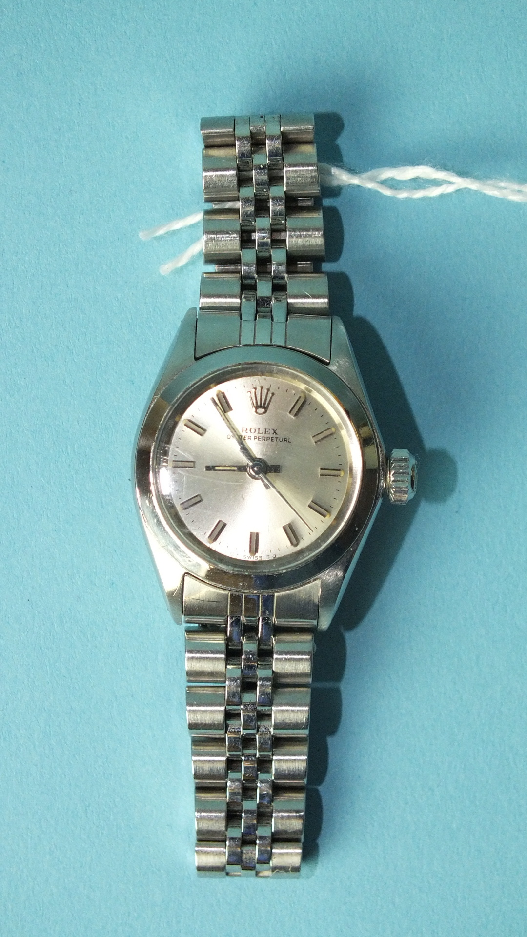 Rolex, a lady's Rolex Oyster Perpetual wrist watch with silvered dial, baton numerals and centre