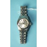 Rolex, a lady's Rolex Oyster Perpetual wrist watch with silvered dial, baton numerals and centre