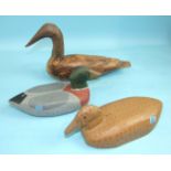 Two wooden painted duck decoys with glass eyes, 23cm long, both inscribed 'Repainted 1989' to base