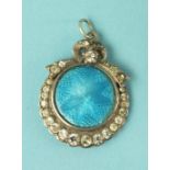 An Edwardian silver circular pendant, with blue guilloche enamel plaque within graduated paste-set