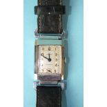 A gent's Strand mechanical wrist watch, the two-tone rectangular dial with Arabic numerals, in steel