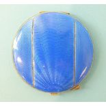 A circular silver powder compact, the blue guilloche lid enamelled in three panels, maker Turner &