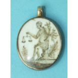 A Georgian mourning locket pendant with ivory oval painted and embellished with hair, with a