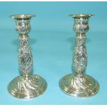 A pair of late-Victorian silver candlesticks of small form, with chased baluster stems, 13cm high,