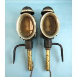 A pair of japanned metal and alloy carriage lamps with metal mounting brackets, 50cm high, (2).