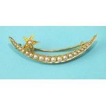 A late-Victorian gold graduated seed pearl open crescent and star brooch, 47mm long, 4g.
