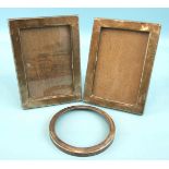 A pair of plain rectangular photo frames, Birmingham 1938, 17 x 12.5cm and a circular photo frame,