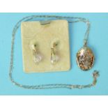 A small 9ct gold locket and a pair of faceted glass earrings, on 9ct gold fittings.