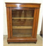 A Victorian inlaid mahogany dwarf bookcase, having a single glazed door, on short turned feet,