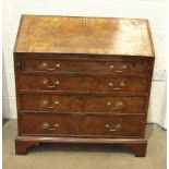 A George III mahogany bureau, the fall front with fitted interior, above four graduated cockbeaded