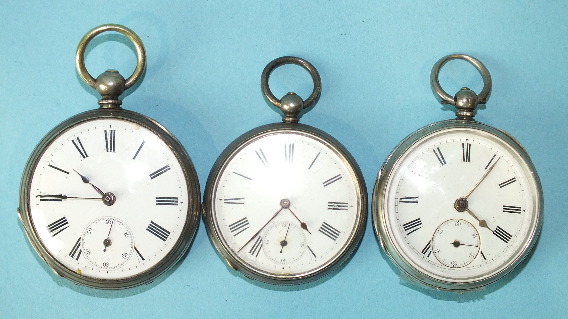 Two silver-cased key-wind open-face pocket watches with white enamel dials, Roman numerals and