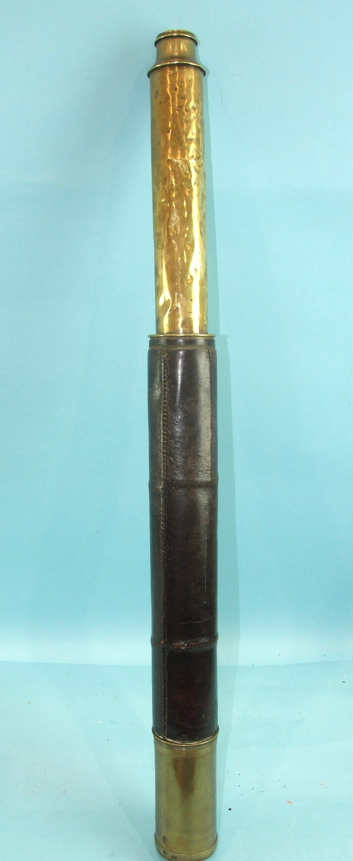 A mid-19th century brass two-draw telescope engraved 'Dolland, London, Day or Night Customs 1842',