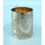 An Edwardian tapered cylinder-form christening mug with gilt interior, engraved with thistles and