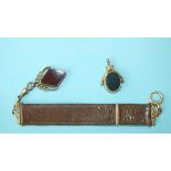 A late-Victorian carnelian/bloodstone swivel fob with 15ct gold mount, 6.5g and another of diamond