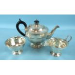 A plain three-piece dodecagon-shaped tea service, Sheffield 1934, ___22oz.