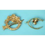 A 9ct gold brooch in the form of a Celtic buckle, 3.1g and a 15ct gold wishbone and clover brooch,