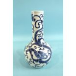 A 19th century Chinese porcelain vase with underglaze blue decoration, with two dragons amidst leafy