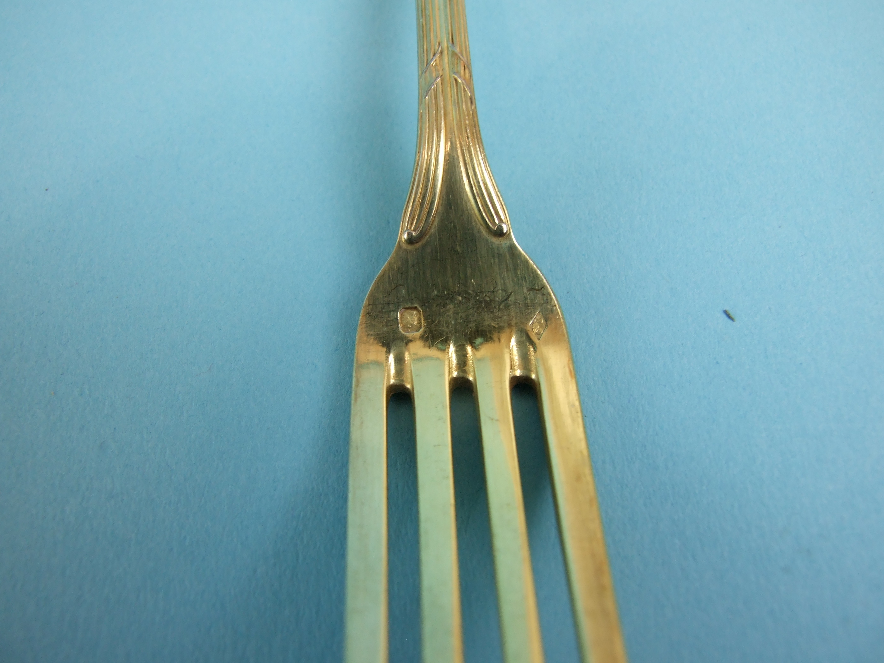 A set of nine each French silver gilt dessert spoons, table forks and knives with loaded handles, - Image 3 of 3