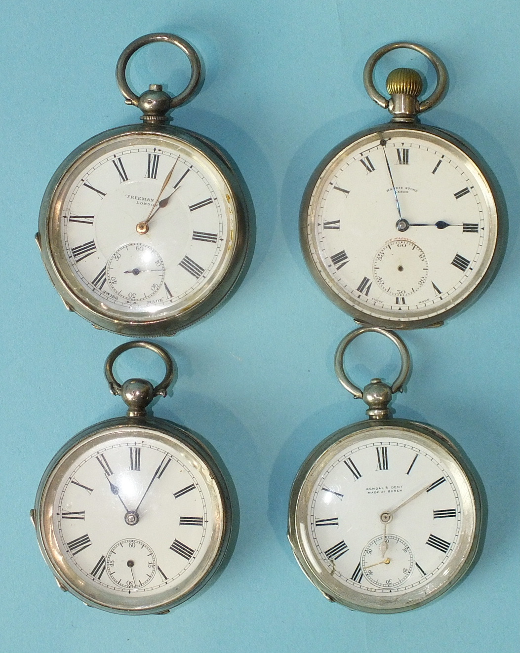 Three silver-cased open-face key-wind pocket watches and one keyless open-face pocket watch, (all