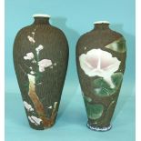 A pair of Japanese porcelain vases decorated with flowering lilies and prunus, on a wood-effect