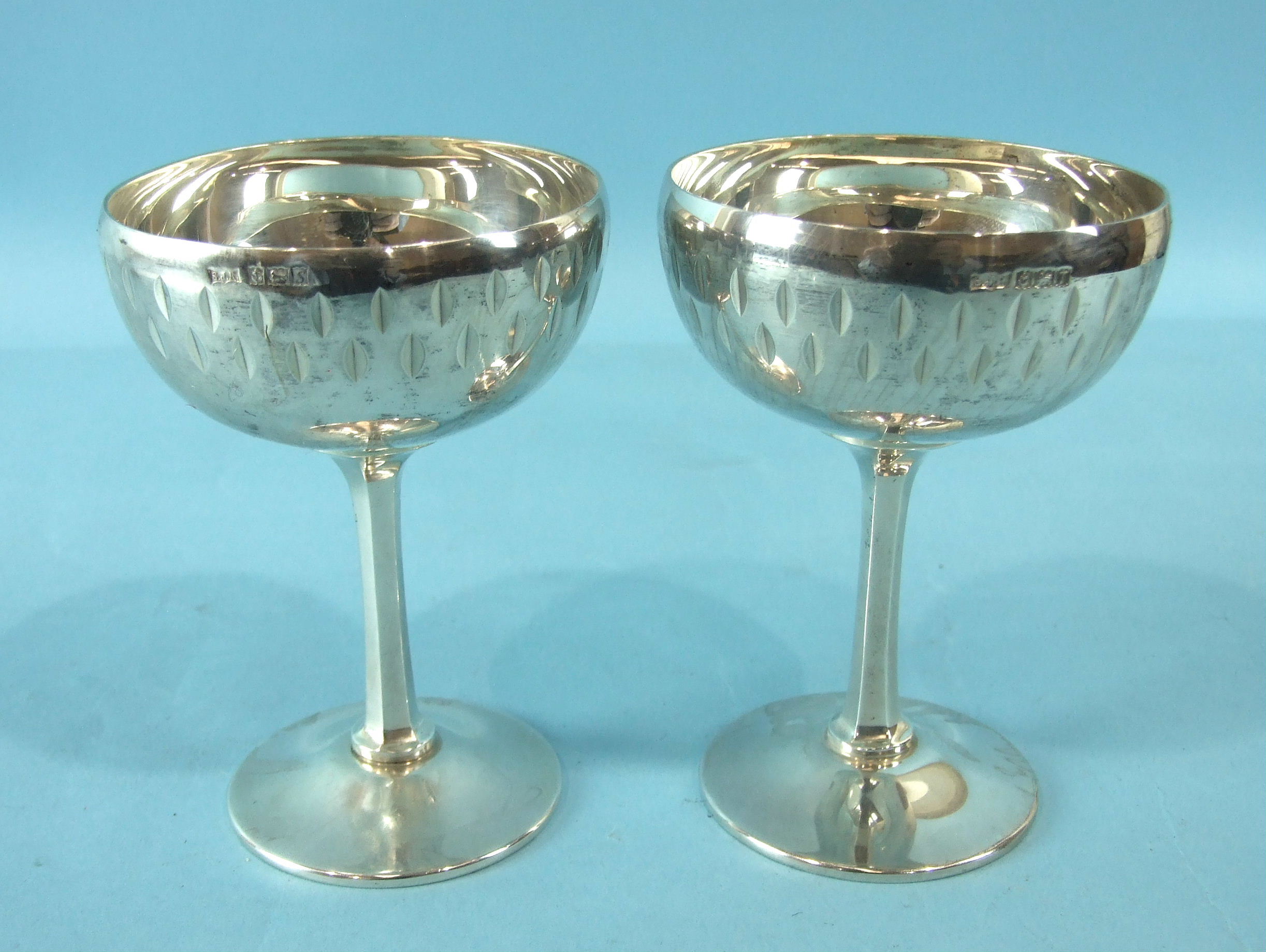 A pair of silver Champagne bowls on hexagonal stems, Birmingham 1968, ___12oz.