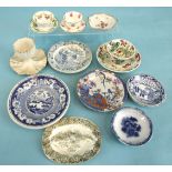 A group of child's plates with willow pattern and other printed decoration, also an egg cup, etc.