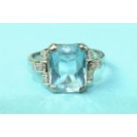 An Art Deco aquamarine and diamond ring, the cross-cut aquamarine of approximately 3.6cts, claw-