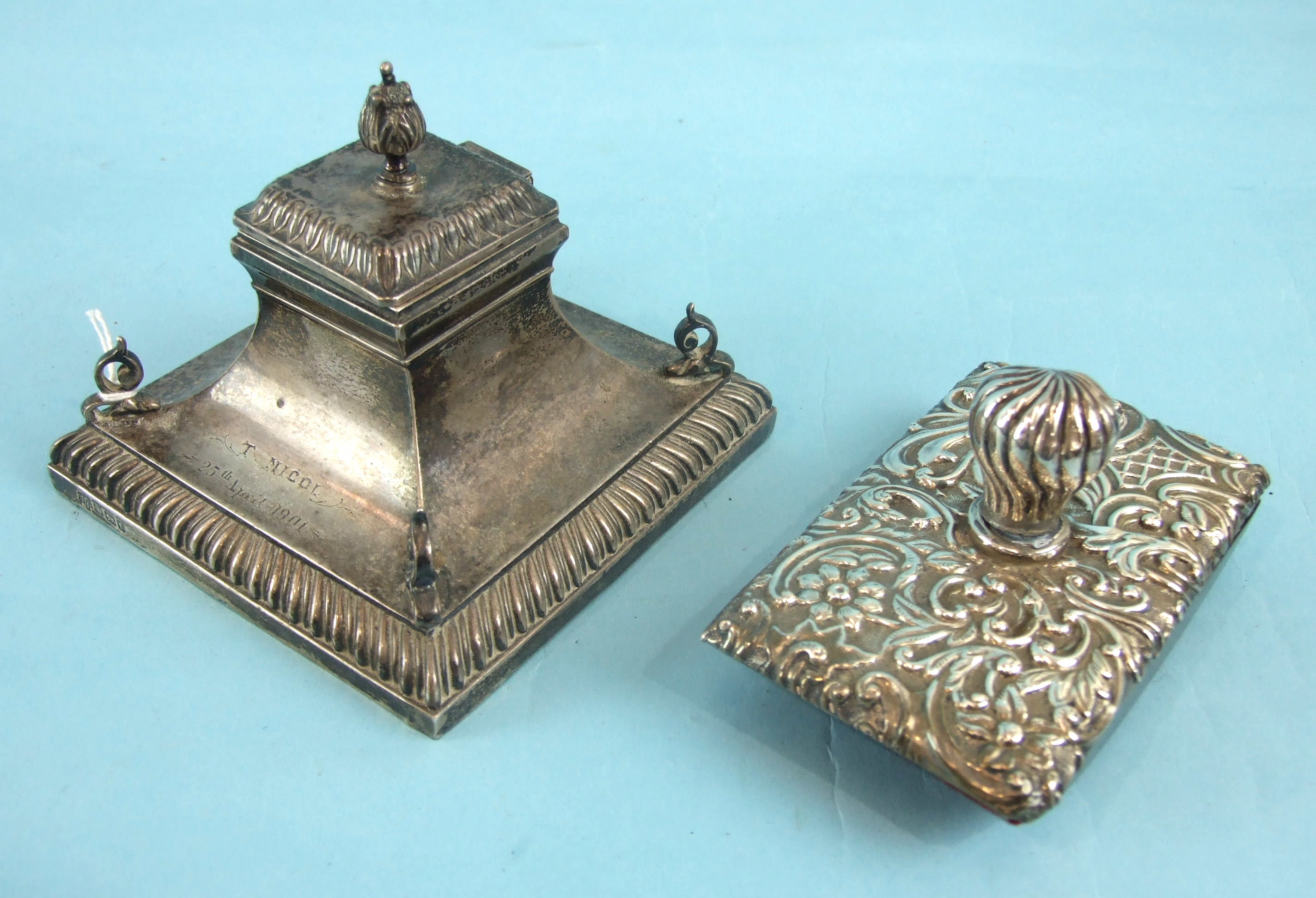 A late-Victorian loaded-silver inkwell of rectangular concave form, with gadrooned plinth and