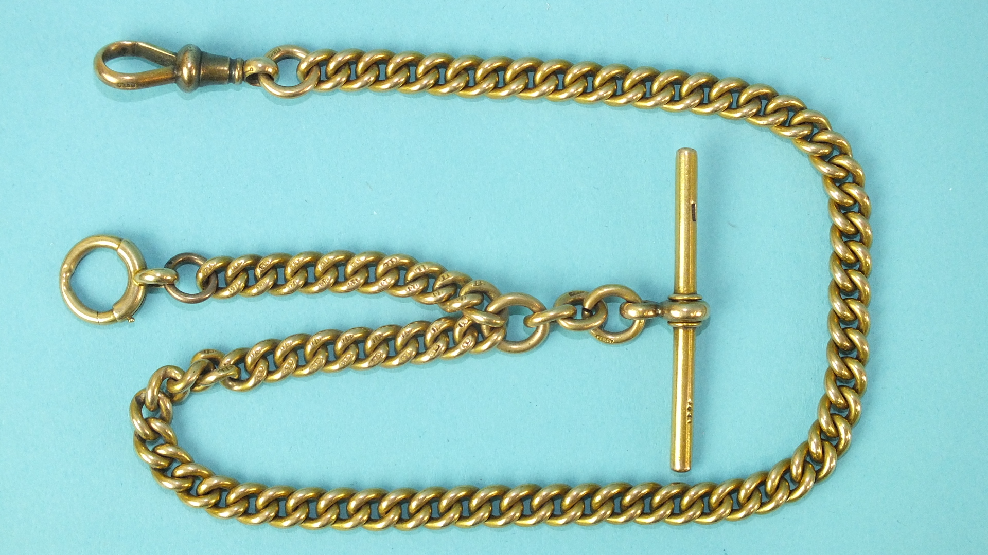 A 15ct gold curb-link half-Albert watch chain, 36cm long, 55g.